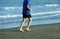 Mature athlete runs on the Sea Beach