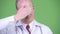 Mature bald man doctor covering eyes