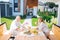 Mature beaming wife and husband wearing white bathrobes having breakfast