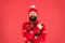 Mature bearded man reindeer sweater. brutal hipster in knitted hat red background. wear christmas mood. knitwear male