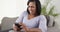 Mature black woman texting smartphone laughing