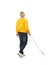 Mature blind person with long cane walking on white