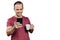 Mature Brazilian man holding a smartphone  a cup and smiling