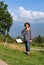 Mature brunette woman, mountains on background