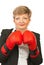 Mature business woman with boxing gloves