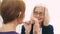 Mature business woman in glasses talking with friend close up.