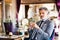 Mature businessman with coffee in a hotel lounge.