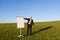 Mature Businessman Pointing At Flipchart, outdoor