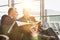 Mature businessman reading news paper while the other businessman is talking on smartphone in airport