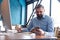 Mature businessman with smartphone in the office.