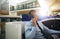 Mature businessman talking on a phone at his office cubicle