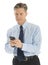 Mature Businessman Text Messaging Through Mobile Phone