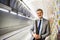 Mature businessman waiting on a metro station.