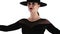 Mature charming woman posing with black hat on white background. Femme fatale costume, stylish outfit, pretty make-up