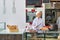 Mature chef arranging fresh strawberry tarts in restaurant