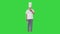 Mature chef, cook or baker holds plate with dessert and making approval gesture on a Green Screen, Chroma Key.