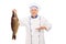 Mature chef holding a big freshwater fish