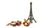 Mature chestnuts and the figure of the Eiffel Tower on a white b