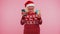 Mature Christmas grandmother woman use mobile cell phone plastic credit bank cards win calebrate wow