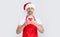 mature christmas man in red santa hat and apron holding coffee cup