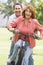 Mature couple bike riding.