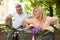 Mature couple on bikes outdoors