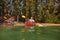 Mature couple canoeing on a lake during a camping trip