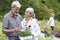 Mature Couple Choosing Plants At Garden Center