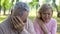 Mature couple crying sitting outdoors, incurable disease, retirement problem