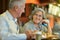 Mature couple eating french fries