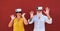 Mature couple having fun with virtual reality goggles technology - Senior people surfing online while wearing vr headsets - Tech,
