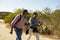 Mature Couple Hiking Outdoors In Countryside Together