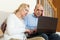 Mature couple with laptop