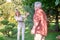 Mature couple looking enjoyed while playing tennis in the park