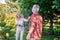 Mature couple looking enjoyed while playing tennis in the park