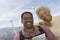 Mature Couple With Map By Wind Farm