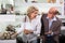 Mature couple picking shoes in boutique