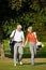 Mature couple playing Golf