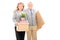 Mature couple posing with moving boxes
