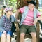 Mature couple sitting on vintage wooden chairs