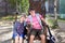 Mature couple sitting on vintage wooden chairs in the park