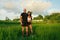 Mature Couple Standing On Rice Field Portrait. Caucasian Man And Asian Woman Resting After Workout.