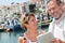 Mature couple with tablet visiting atlantic seaside