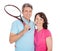 Mature couple with tennis racquets
