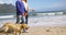 Mature couple walking on beach