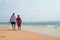 Mature couple walking on beach