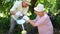 Mature couple watering together