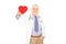 Mature doctor holding a small red heart