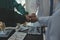 Mature doctors and young nurses stacking hands together at hospital. Close up hands of medical team stacking hands. Group of