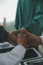 Mature doctors and young nurses stacking hands together at hospital. Close up hands of medical team stacking hands. Group of